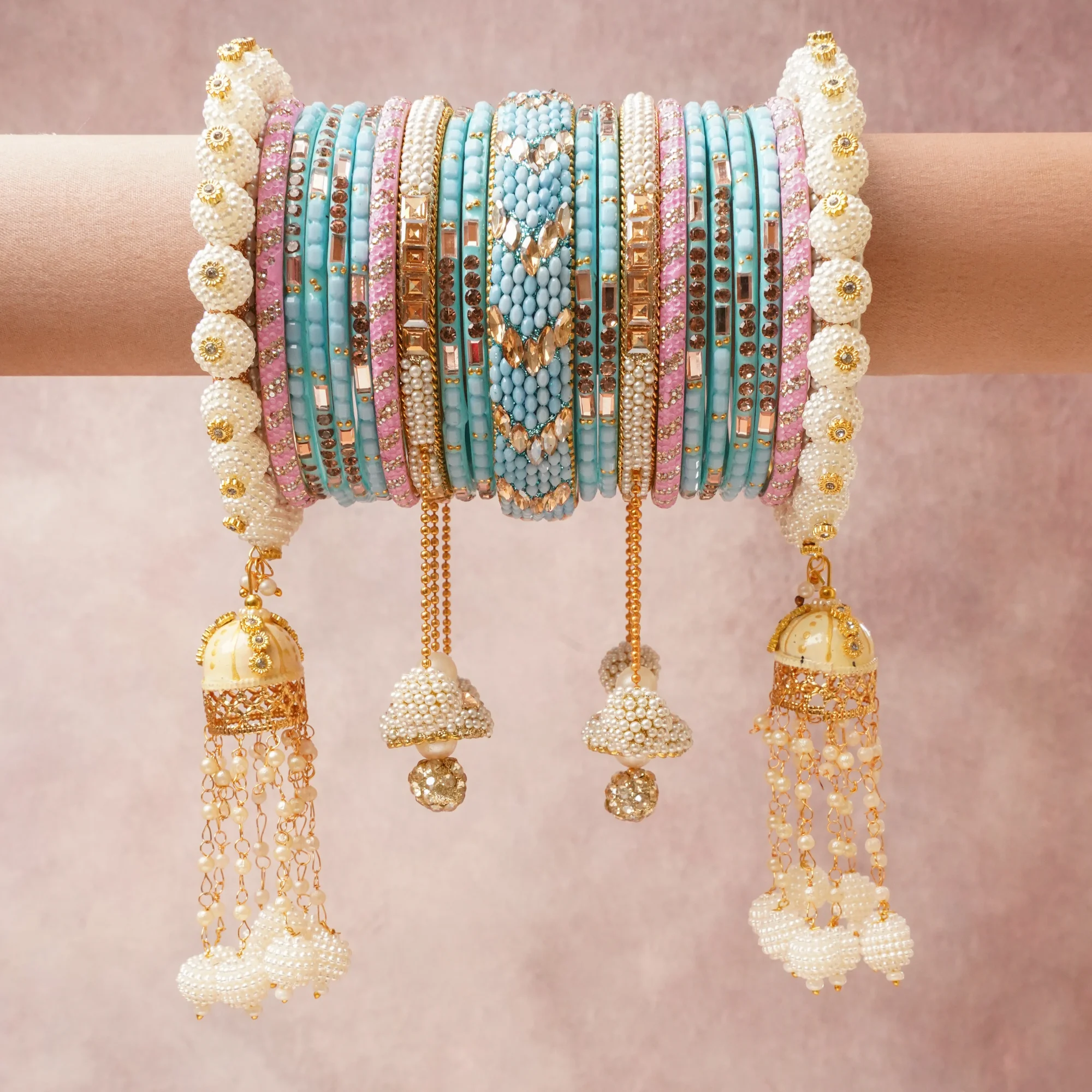 A majestic Sky Blue set, complemented by Gold featuring Glass, Acrylic, Faux Pearls, Rhinestones, Gold-toned Metal, Enamel.
Rich, ceremonial, and designed to be passed through generations.